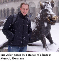 Photo of student Eric Ziller and a statue of a boar in Munich, Germany