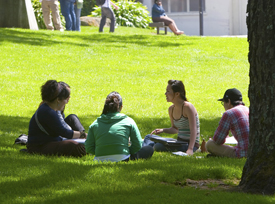 A photo of SF State students sitting on the quad.