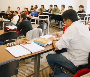 A photo of students studying in a classroom.