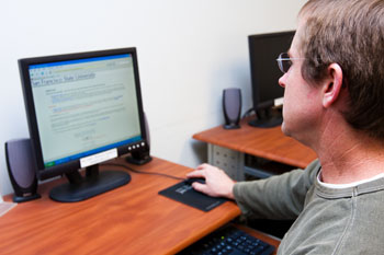 Photo of a man using a computer in the Career Center.