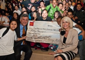 A photo of Wells Fargo representatives and Martin Luther King Middle School students with a check from Wells Fargo to SF Promise.
