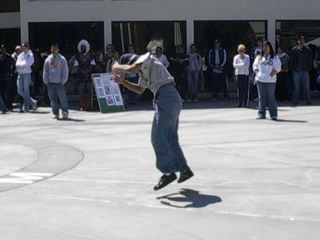 One breakdancer in the middle of a trick