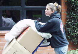A student carries her belongings into Mary Park Hall
