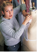 Photo of a student working on a dressmaker's mannequin