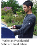 Photo of Presidential Scholar David Tabari sliding a letter into a campus mailbox