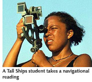 Photo of a Tall Ships student using a navigational device