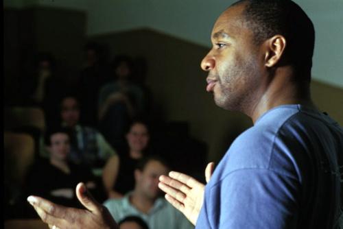 Photo of Branford Marsalis speaking to a group of students