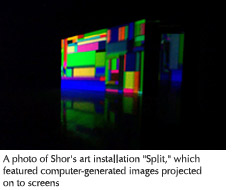 Photo of Shor's art installation "Split" which features computer-generated images projected on to screens