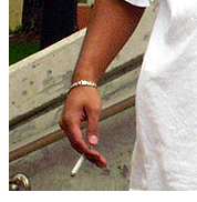Photo of hand holding a cigarette