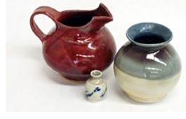 Photo of three ceramics pieces -- a pitcher and two vases
