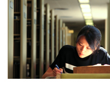Photo of a student studying in the Library
