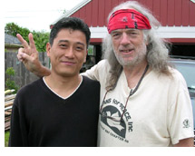 Photo of Chul Heo and anti-war activist Brian Wilson