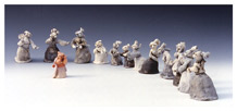 SFSU art student Tomoko Nakazato's ceramic piece titled 'Murahachibu' features 12 emotive chicken figurines standing in a semi-circle wearing classical European garb