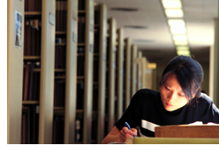 Photo of a student studying in the J. Paul Leonard Library