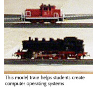 Photo of tthe model train that is used to help students create computer operating systems