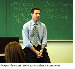 Photo of San Francisco Mayor Gavin Newsom listening to a student's comments