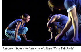 Photo of a part of a performance of Mlay's "With This Faith," featuring three dancers who have sunk to their knees with heads bowed