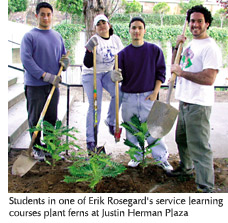 Photo of students in a community service learning course planting ferns at Justin Herman Plaza