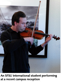 Photo of an SFSU international student perfroming on the violin at a recent campus reception