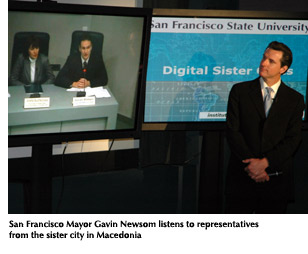 Photo of San Francisco Mayor Gavin Newsom listening to representatives from one of the city's digital sister cities at the SFSU event