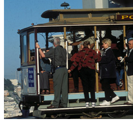 Photo of a group of baby boomers on a San Francisco cable car