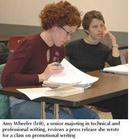 Photo of Amy Wheeler, a senior majoring in technical and professional writing, reviewing a press release she wrote for a class on promotional writing