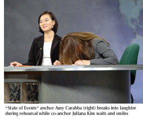 Photo of "State of the News" anchor Amy Carabba breaking into laughter during rehearsal as co-anchor Juliana Kim tries to maintain her composure 