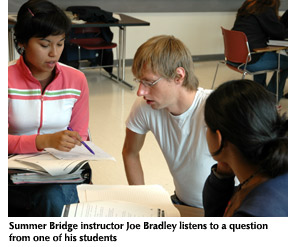 Photo of Summer Bridge instructor Joe Bradley listening to a question from one of his students