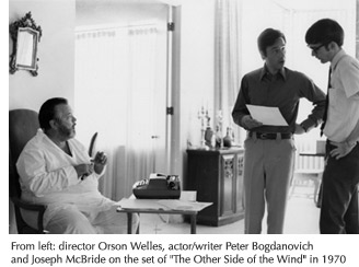 Photo of director Orson Welles, writer/actor Peter Bogdonavich and Joseph McBride on The Other Side of the Wind set in 1970