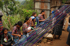 A photo of women weaving in a village in Guatemala. 