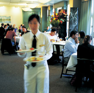 A photo of hospitality management students working in the Vista Room.