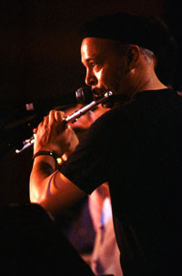 Photo of Music Lecturer John Calloway playing the flute