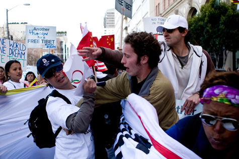 Photo of people protesting China's involvement in the Olympics at the torch run in San Francisco.