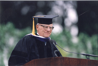 A photo of Richard Goldman at the lectern during the 2001 Commencement