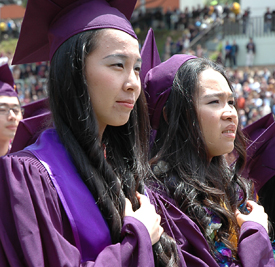 A photo of two students at Commencement.