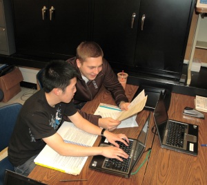 Student volunteers help clients with their tax forms