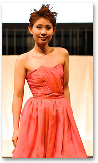 A photo of a student modeling clothing during the 2011 SF State student fashion show.