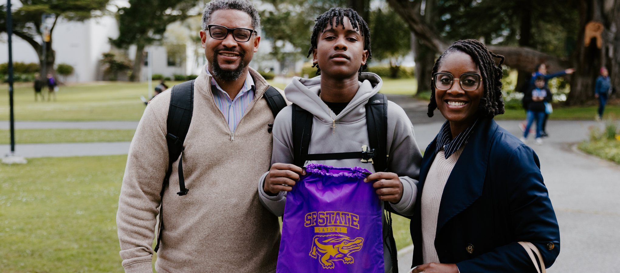 Family showing SF State gator bag