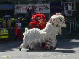 Two lion dancers in costume.