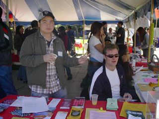Two volunteers at a table.