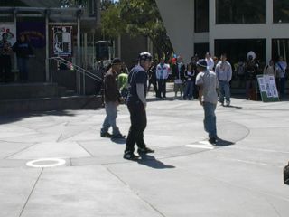 Three breakdancers perform in the Plaza
