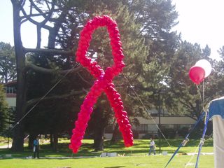 Red ribbon AIDS symbol made entirely of balloons