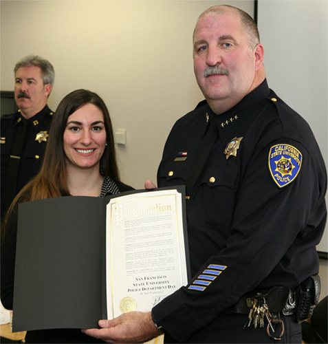 Mayoral Liaison presents Mayor's proclamation to SF State Police chief