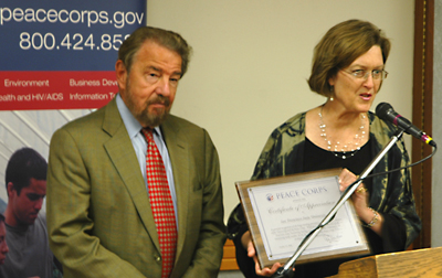 San Francisco State President Robert A. Corrigan accepts an award from Peace Corps Deputy Director Jody Olsen on Oct. 23