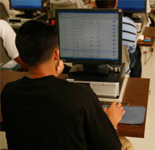 Photograph of a student using the SF State Class Schedule online.