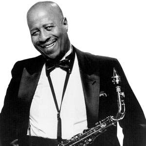 A black and white photo of saxophonist John Handy.