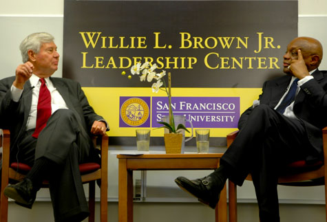 Sen. Bob Graham (left) speaks with Mayor Willie Brown (right)