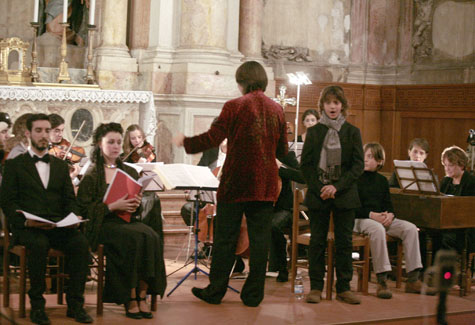 A photo of Italian musicians and singers performing in the restored Oratorio del Gonfalone, a marbled chamber dating back to the 16th century.