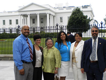 Photo of Director of the Health Equity Institute Cynthia Gomez (third from left) and representatives from partners in the Bay Area Network for Positive Health, who attended a discussion on public-private partnerships in HIV care, hosted at the White House.