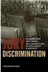 Book jacket for 'Jury Discrimination' which includes a photo of a courtroom